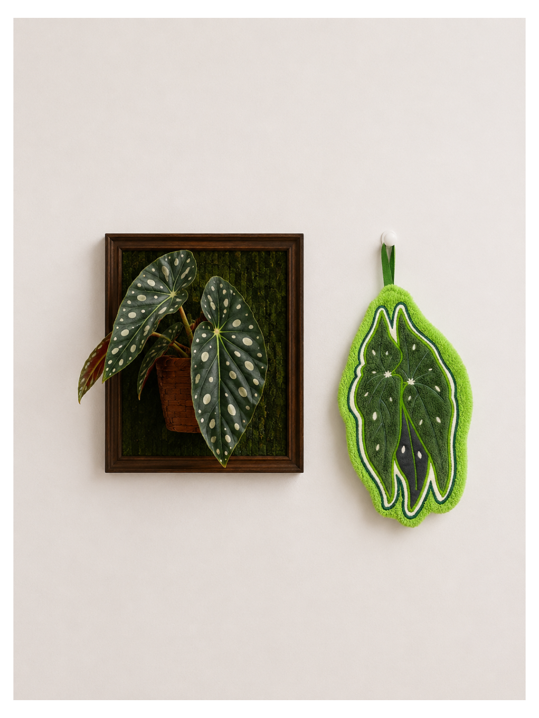 Green felt leaf-shaped hand towel with spotted botanical pattern, part of the Paw&Leaf hand towel collection