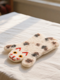 Wool Felt Animal Coaster - spotted cat-shaped felt coaster in cream with red embroidered face detail