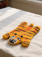 Wool Felt Animal Coaster - tiger-shaped felt coaster in yellow, orange and black stripes, flat view