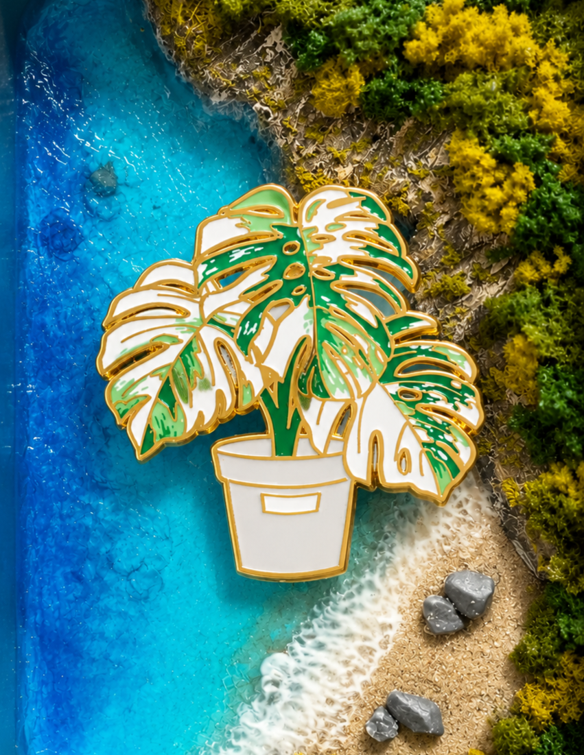 Metal Plant Friend Magnet - Monstera Deliciosa leaf-shaped metal fridge magnet in green and white with gold trim