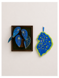 Begonia Leaf Hand Towel - blue felt leaf-shaped hand towel beside framed blue begonia leaf art