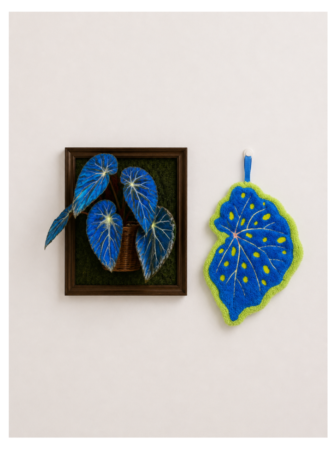 Begonia Leaf Hand Towel - blue felt leaf-shaped hand towel beside framed blue begonia leaf art