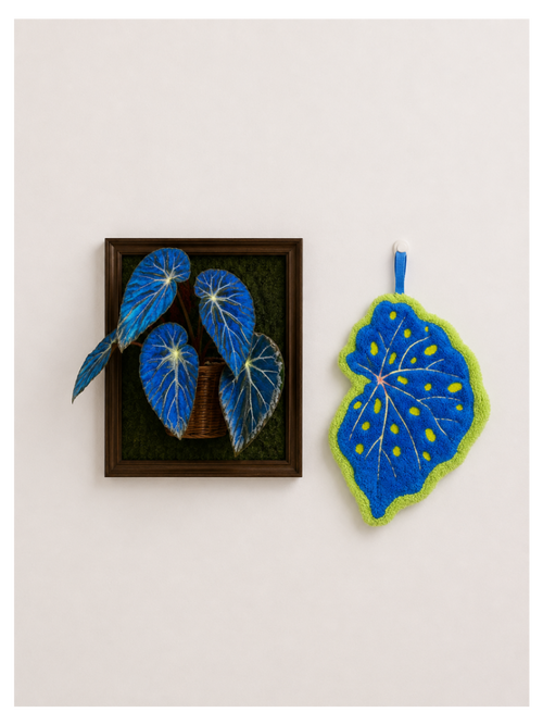 Begonia Leaf Hand Towel - blue felt leaf-shaped hand towel beside framed blue begonia leaf art