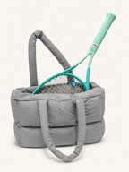 Soft Puffer Tote Bag in gray holding a tennis racket - gym and sports carryall