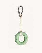 Boulder Grip Charm in light green - donut-shaped climbing grip keychain with rope and carabiner