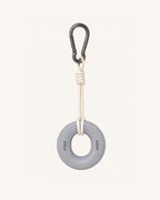 Boulder Grip Charm in grey - donut-shaped climbing grip keychain with cream rope and carabiner